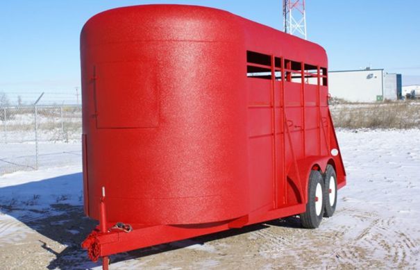Livestock trailer with red LINE-X coating
